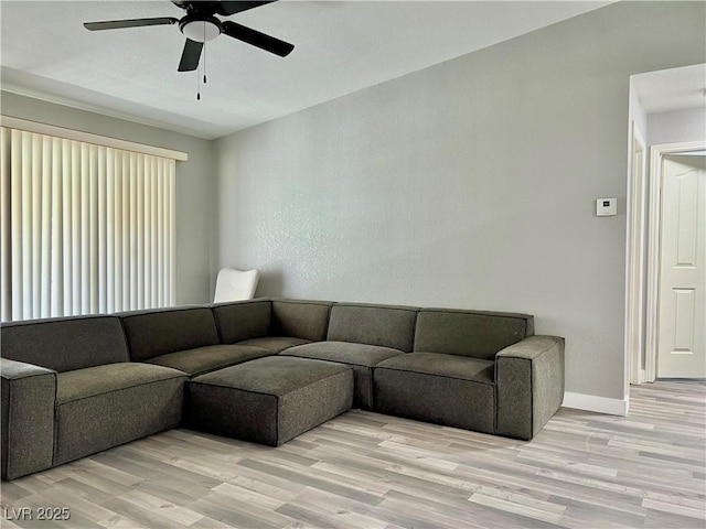 2627 S Durango Dr Unit 202, Las Vegas, NV 89117 - living room with light wood-type flooring and a ceiling fan