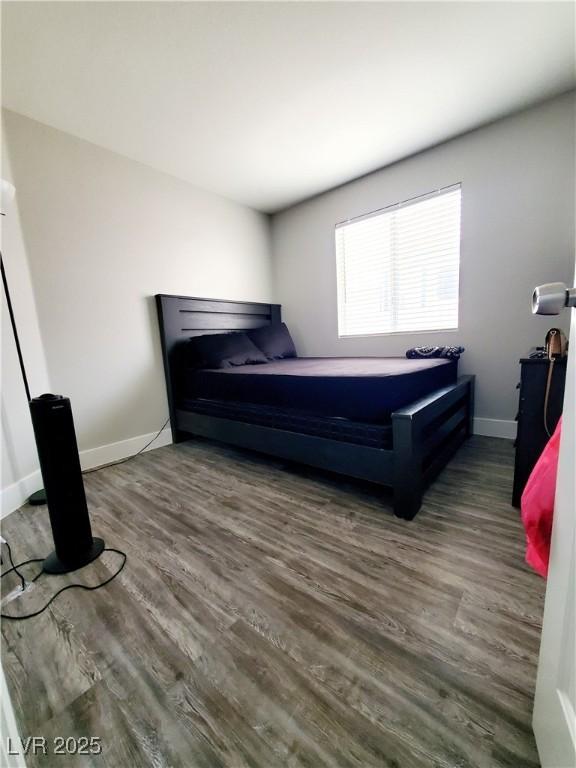 5104 Brookmere Dr, Las Vegas, NV 89130 - bedroom with wood finished floors and baseboards