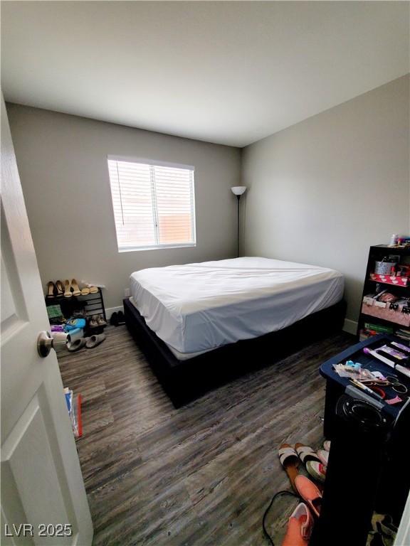 5104 Brookmere Dr, Las Vegas, NV 89130 - bedroom featuring wood finished floors and baseboards