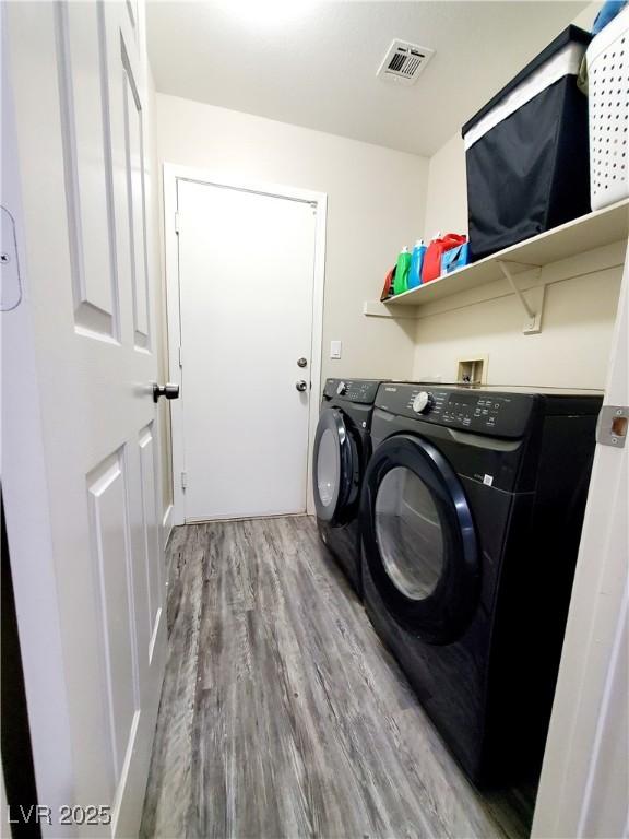 5104 Brookmere Dr, Las Vegas, NV 89130 - washroom featuring wood finished floors and washer and dryer