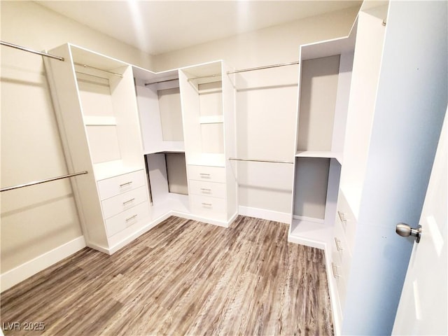 5104 Brookmere Dr, Las Vegas, NV 89130 - walk in closet with light wood-style flooring and built in desk