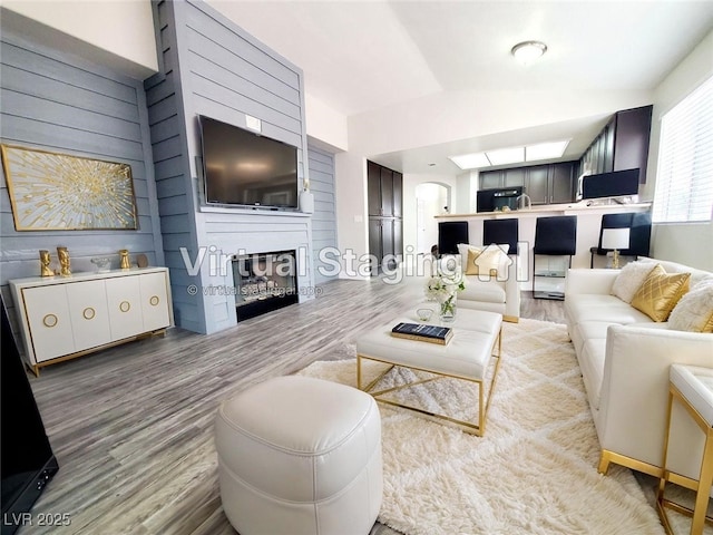 5104 Brookmere Dr, Las Vegas, NV 89130 - living room with wood finished floors, a fireplace, and vaulted ceiling