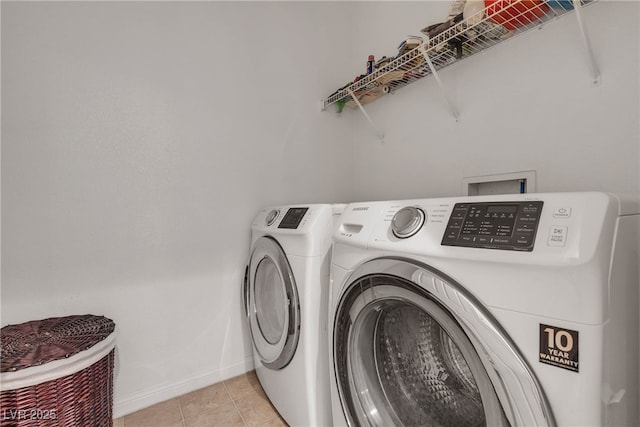 9269 Moonlight Nest Ln, Las Vegas, NV 89178 - washroom featuring washer and clothes dryer and light tile patterned flooring