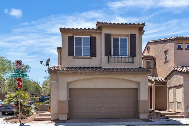 9269 Moonlight Nest Ln, Las Vegas, NV 89178 - view of front of house with a garage, a tile roof, stucco siding, and driveway
