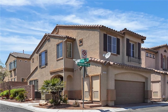 9269 Moonlight Nest Ln, Las Vegas, NV 89178 - view of front facade with a garage, stucco siding, and a tiled roof