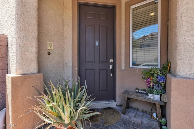 9269 Moonlight Nest Ln, Las Vegas, NV 89178 - doorway to property featuring stucco siding