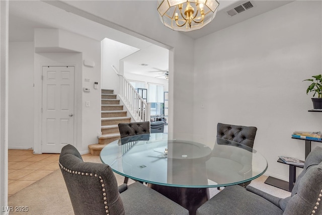 9269 Moonlight Nest Ln, Las Vegas, NV 89178 - dining space featuring stairway, a ceiling fan, a chandelier, and light tile patterned floors