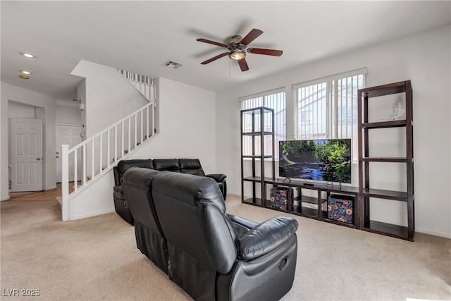 9269 Moonlight Nest Ln, Las Vegas, NV 89178 - carpeted living area with stairs and a ceiling fan