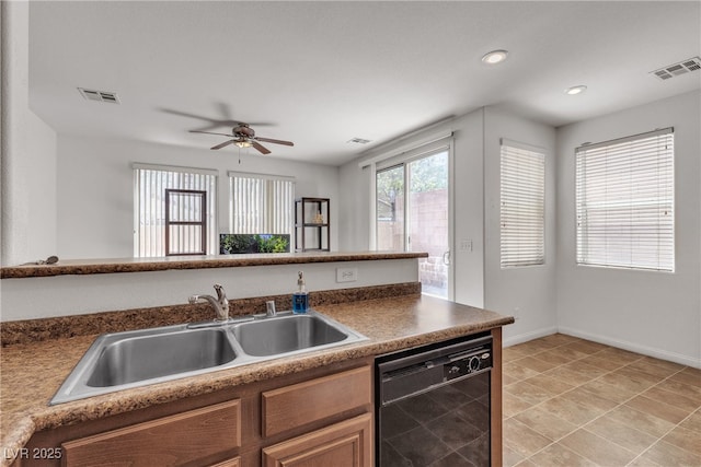 9269 Moonlight Nest Ln, Las Vegas, NV 89178 - kitchen featuring dishwasher, recessed lighting, a ceiling fan, dark countertops, and brown cabinets