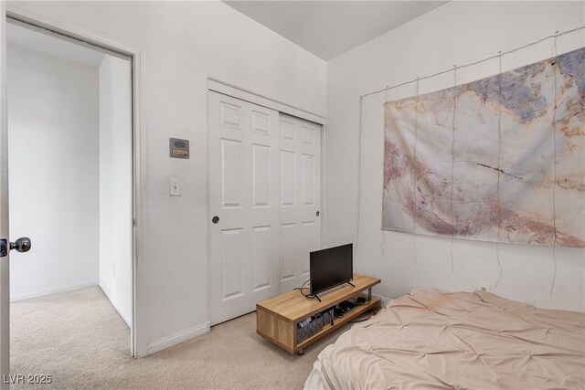 9269 Moonlight Nest Ln, Las Vegas, NV 89178 - bedroom featuring light carpet and a closet