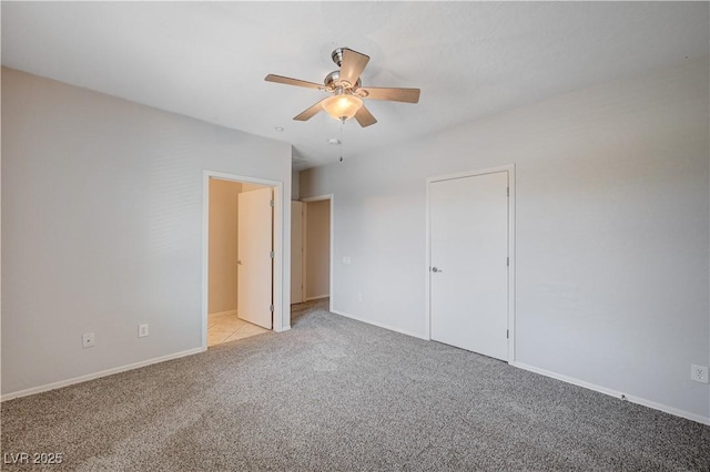 4610 Puglia Ln Unit 201, North Las Vegas, NV 89084 - unfurnished bedroom featuring light carpet and ceiling fan