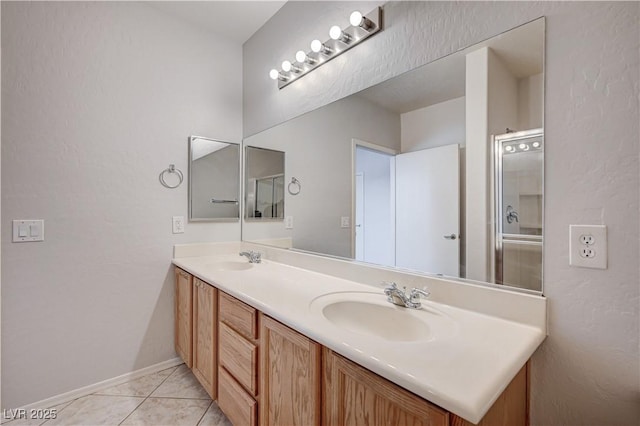4610 Puglia Ln Unit 201, North Las Vegas, NV 89084 - bathroom featuring double vanity and tile patterned flooring