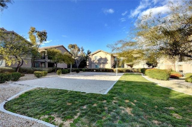 4610 Puglia Ln Unit 201, North Las Vegas, NV 89084 - view of property's community featuring a yard, volleyball court, and a residential view