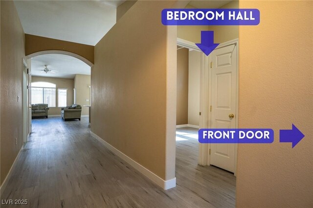 9710 Geiger Peak Ct, Las Vegas, NV 89148 - hall featuring arched walkways and wood finished floors
