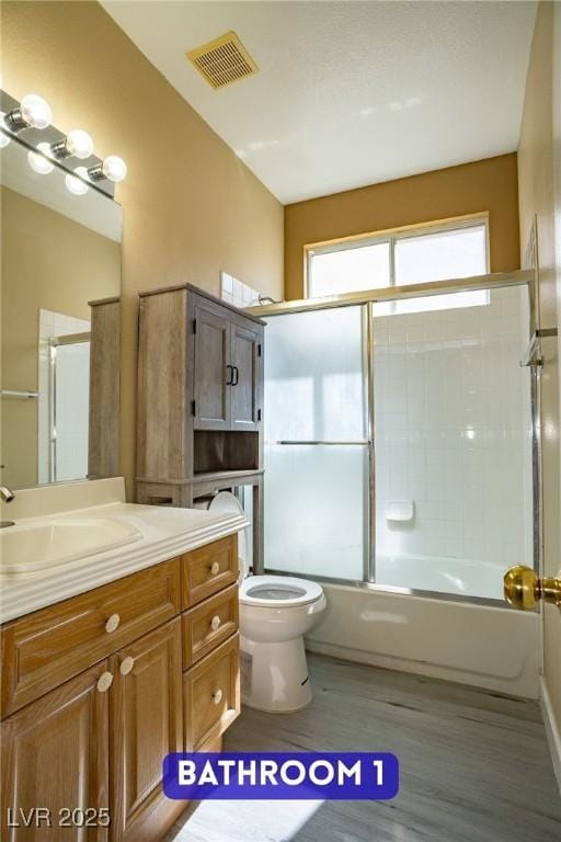 9710 Geiger Peak Ct, Las Vegas, NV 89148 - bathroom featuring vanity, enclosed tub / shower combo, and wood finished floors