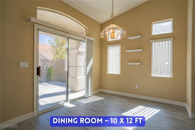 9710 Geiger Peak Ct, Las Vegas, NV 89148 - doorway to outside with wood finished floors, plenty of natural light, a chandelier, and lofted ceiling