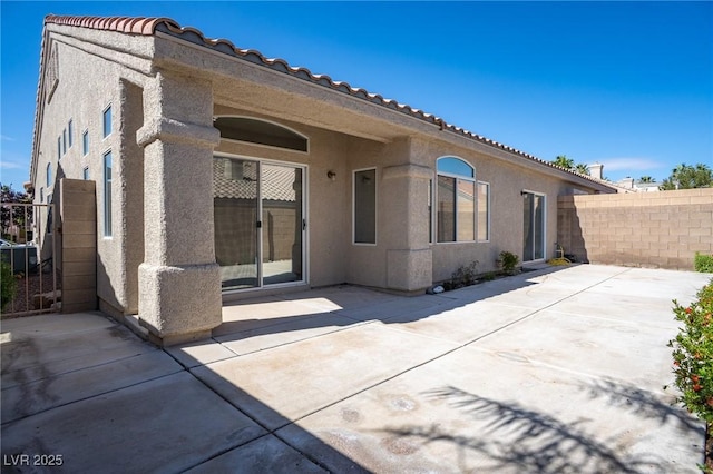 9710 Geiger Peak Ct, Las Vegas, NV 89148 - rear view of property with stucco siding, a patio, and a tile roof