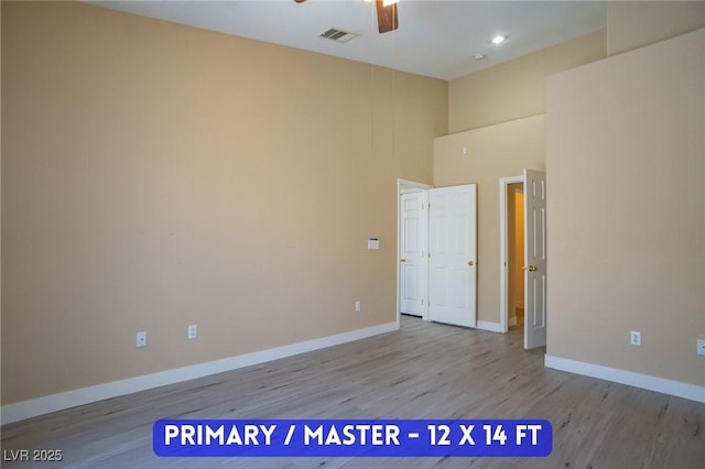 9710 Geiger Peak Ct, Las Vegas, NV 89148 - spare room featuring ceiling fan, wood finished floors, a towering ceiling, and recessed lighting