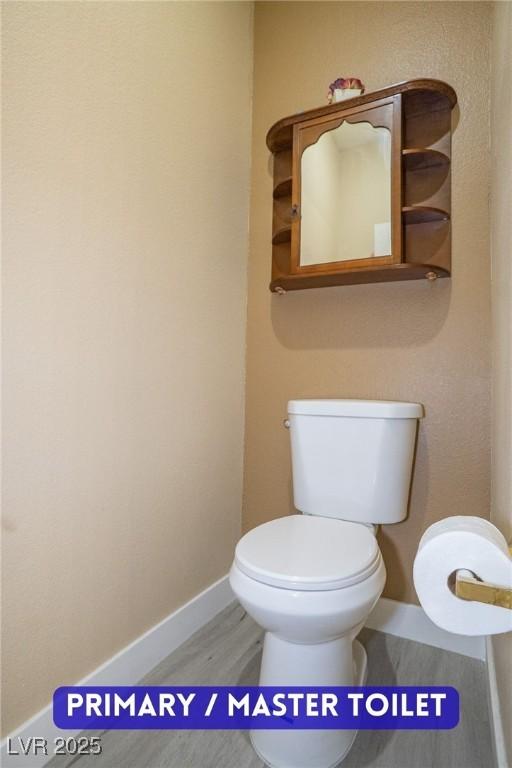9710 Geiger Peak Ct, Las Vegas, NV 89148 - bathroom featuring toilet and wood finished floors
