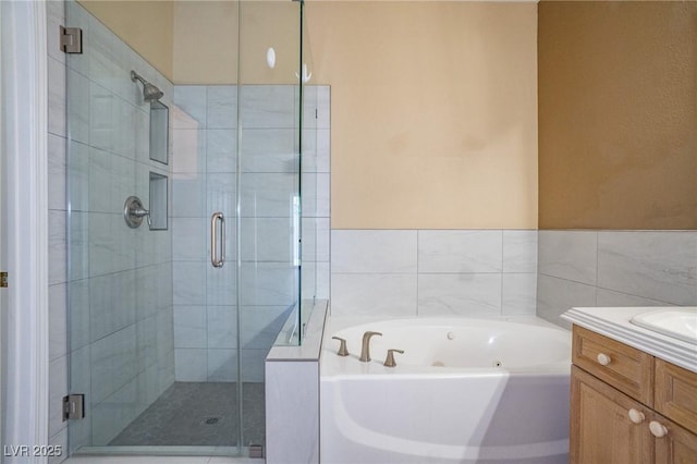 9710 Geiger Peak Ct, Las Vegas, NV 89148 - bathroom featuring a stall shower, a jetted tub, and vanity