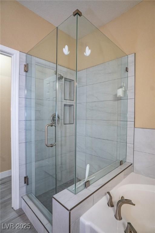 9710 Geiger Peak Ct, Las Vegas, NV 89148 - bathroom with a stall shower and a bath