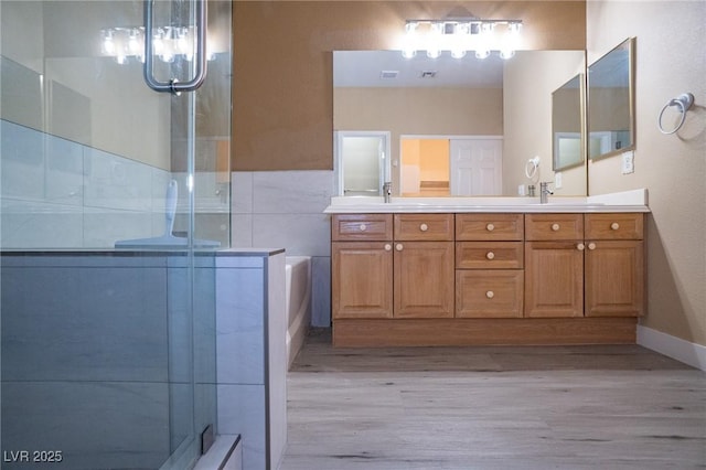 9710 Geiger Peak Ct, Las Vegas, NV 89148 - full bath with wood finished floors, double vanity, a shower stall, and a chandelier