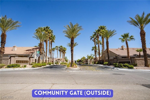 9710 Geiger Peak Ct, Las Vegas, NV 89148 - view of asphalt road featuring curbs and sidewalks