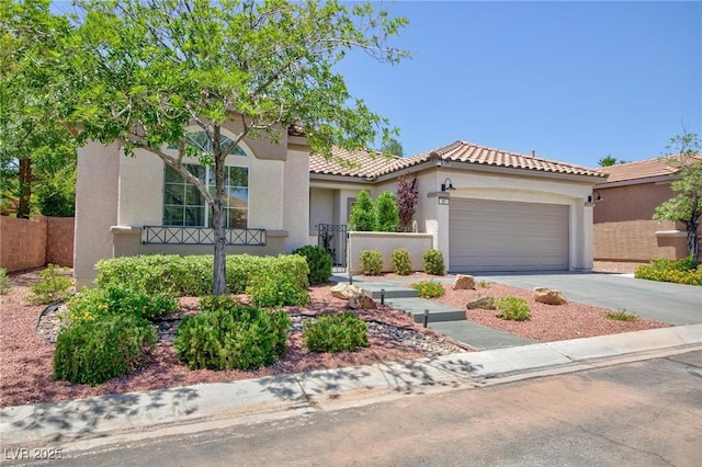 85 Alerion St, Las Vegas, NV 89138 - mediterranean / spanish-style house with driveway, a garage, stucco siding, and a tile roof