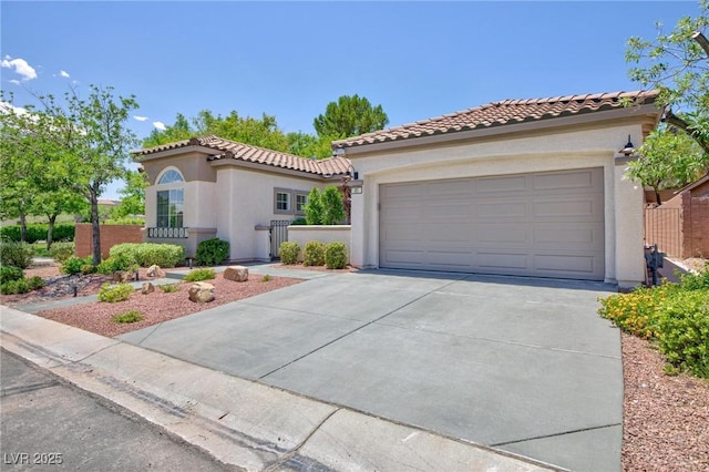 85 Alerion St, Las Vegas, NV 89138 - mediterranean / spanish house featuring concrete driveway, stucco siding, a tile roof, and a garage