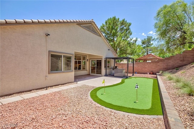 85 Alerion St, Las Vegas, NV 89138 - view of yard with an area to practice putting and a patio area