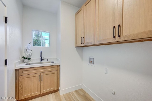 85 Alerion St, Las Vegas, NV 89138 - laundry area with light wood finished floors, cabinet space, and washer hookup