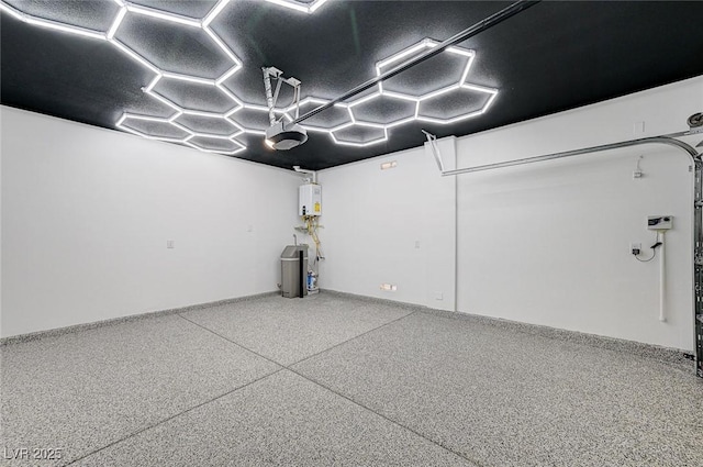 85 Alerion St, Las Vegas, NV 89138 - garage featuring water heater and a garage door opener