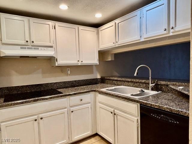 750 S Royal Crest Cir Unit 325, Las Vegas, NV 89169 - kitchen with black appliances, under cabinet range hood, white cabinets, and recessed lighting