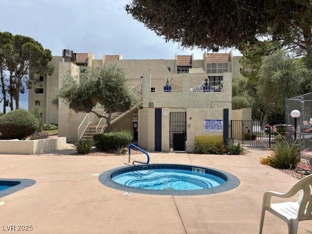 750 S Royal Crest Cir Unit 325, Las Vegas, NV 89169 - view of swimming pool with a hot tub and stairs