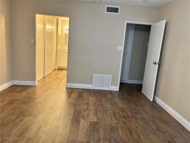 750 S Royal Crest Cir Unit 325, Las Vegas, NV 89169 - spare room with hardwood / wood-style flooring and baseboards