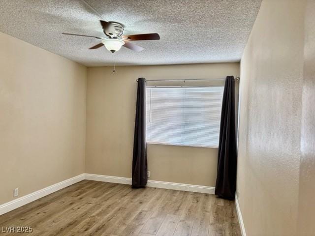 750 S Royal Crest Cir Unit 325, Las Vegas, NV 89169 - empty room featuring wood finished floors, a ceiling fan, and a textured ceiling