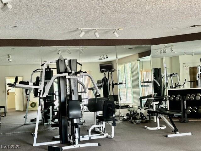 750 S Royal Crest Cir Unit 325, Las Vegas, NV 89169 - exercise room featuring a textured ceiling