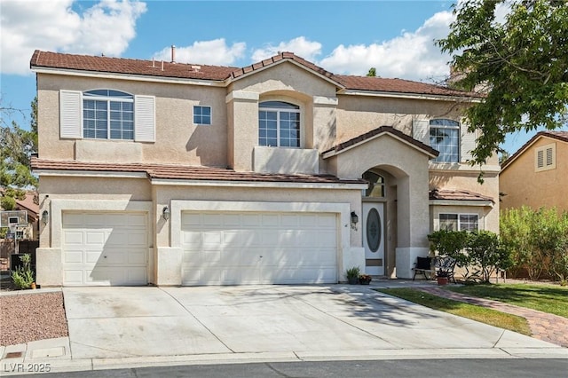 5434 Lost Ln, Las Vegas, NV 89118 - mediterranean / spanish-style house featuring an attached garage, concrete driveway, stucco siding, and a tile roof