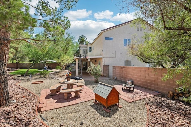 5434 Lost Ln, Las Vegas, NV 89118 - fenced backyard with an outdoor fire pit and a patio