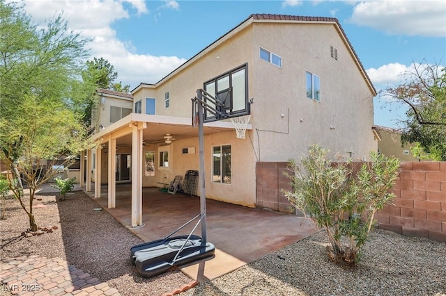 5434 Lost Ln, Las Vegas, NV 89118 - back of property with ceiling fan, stucco siding, and a patio