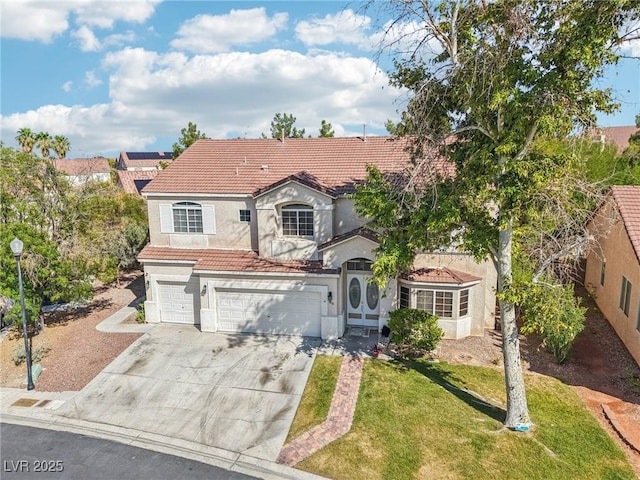 5434 Lost Ln, Las Vegas, NV 89118 - mediterranean / spanish home with a garage, a tile roof, stucco siding, driveway, and a front yard