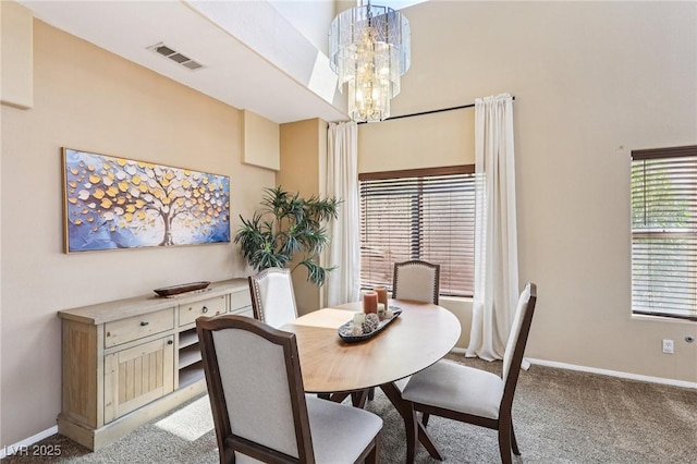 5434 Lost Ln, Las Vegas, NV 89118 - dining room with light carpet and a chandelier