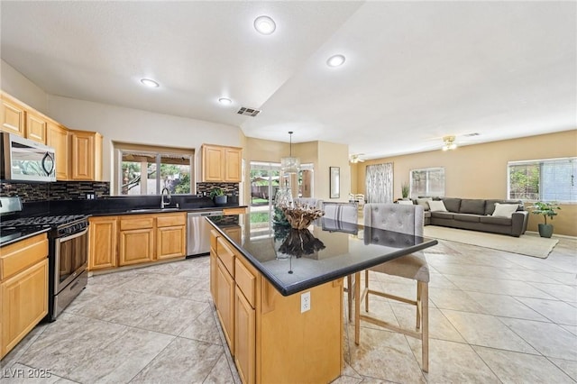 5434 Lost Ln, Las Vegas, NV 89118 - kitchen with appliances with stainless steel finishes, plenty of natural light, tasteful backsplash, and recessed lighting