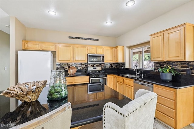 5434 Lost Ln, Las Vegas, NV 89118 - kitchen featuring stainless steel appliances, light brown cabinets, dark countertops, decorative backsplash, and recessed lighting