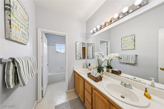 5434 Lost Ln, Las Vegas, NV 89118 - bathroom with double vanity, tile patterned floors, and washtub / shower combination