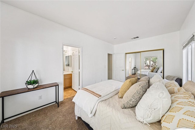 5434 Lost Ln, Las Vegas, NV 89118 - bedroom featuring carpet floors, a closet, and connected bathroom