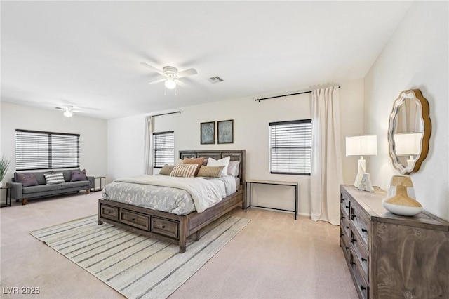 5434 Lost Ln, Las Vegas, NV 89118 - bedroom featuring light colored carpet, multiple windows, and ceiling fan