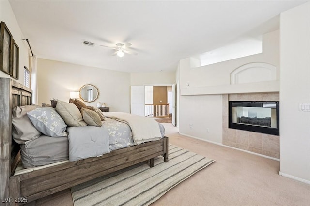5434 Lost Ln, Las Vegas, NV 89118 - bedroom featuring a fireplace, light colored carpet, and ceiling fan
