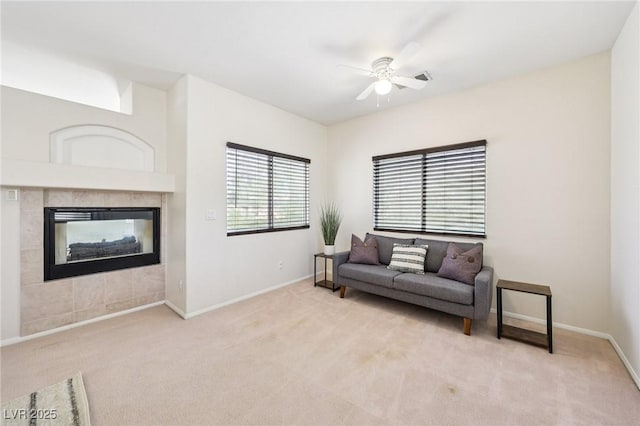 5434 Lost Ln, Las Vegas, NV 89118 - living room with light colored carpet, ceiling fan, and a fireplace