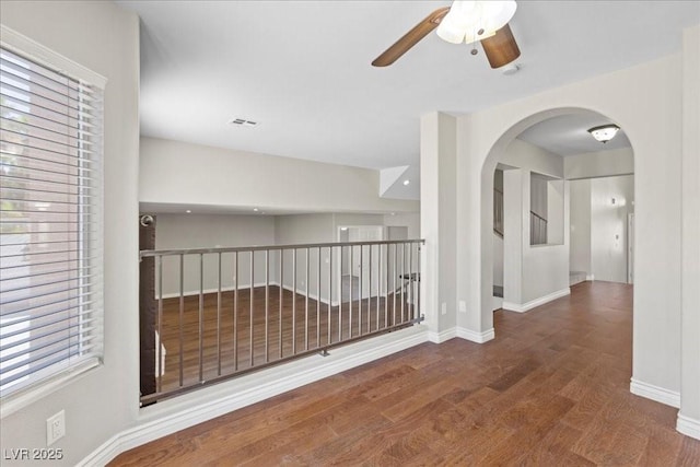 2842 Via Florentine St, Henderson, NV 89074 - hall with wood finished floors and arched walkways